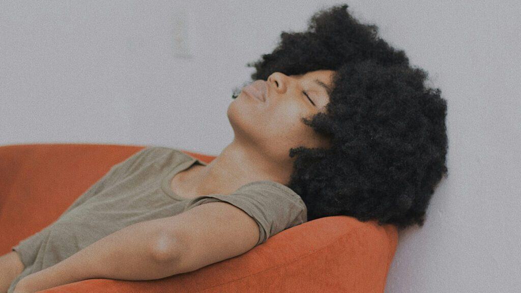 A weary African-American woman conveys the message of the blog post titled "It Broke Me But It Blessed Me."