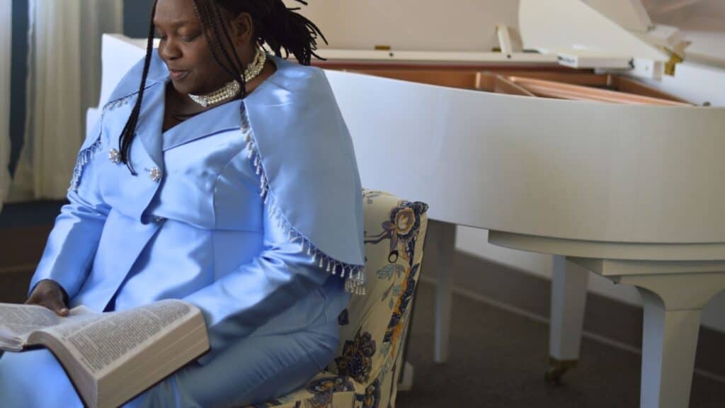 Author Melinda Lauderdale of Mt Zion Missionary Baptist Church in Sioux City Iowa sits with her Bible sharing words of encouragement for Christian women