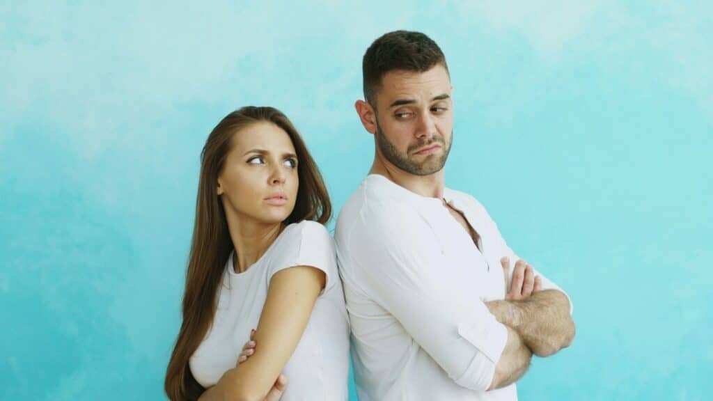 Couple arguing back to back demonstrating that it ain't easy loving difficult people. Ephesians sermon blog